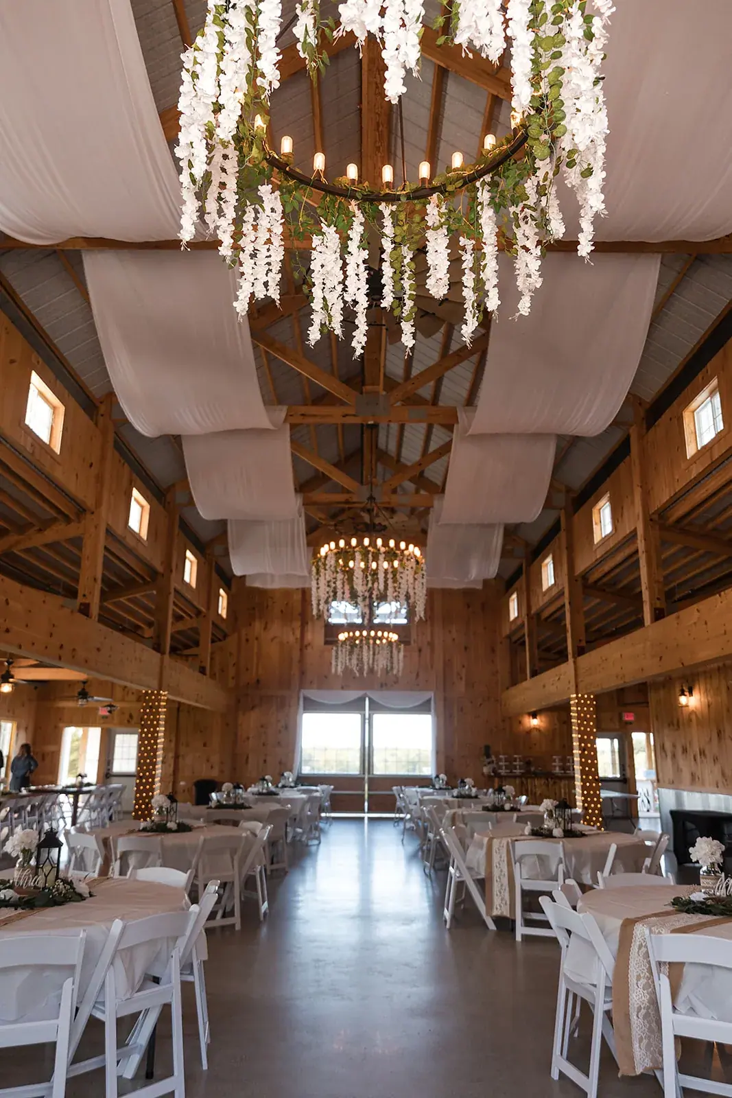 Barn reception chandeliers — Amelia & Howard's wedding at Sunset Hill Wedding Barn, Central Lake