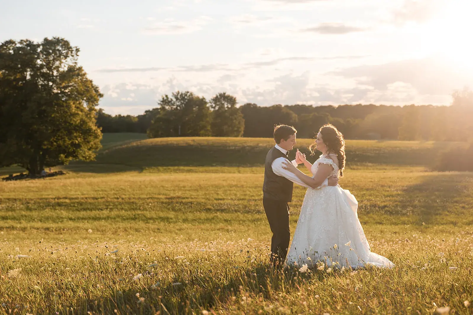 Bride and groom dancing field sunset — Amelia & Howard's wedding at Sunset Hill Wedding Barn, Central Lake