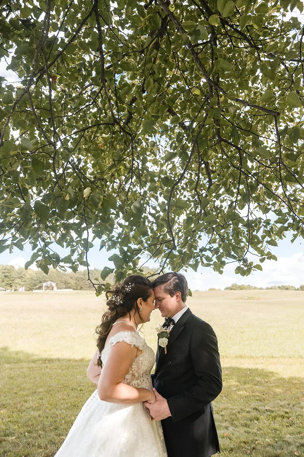 Bride and groom under oak tree — Amelia & Howard's wedding at Sunset Hill Wedding Barn, Central Lake
