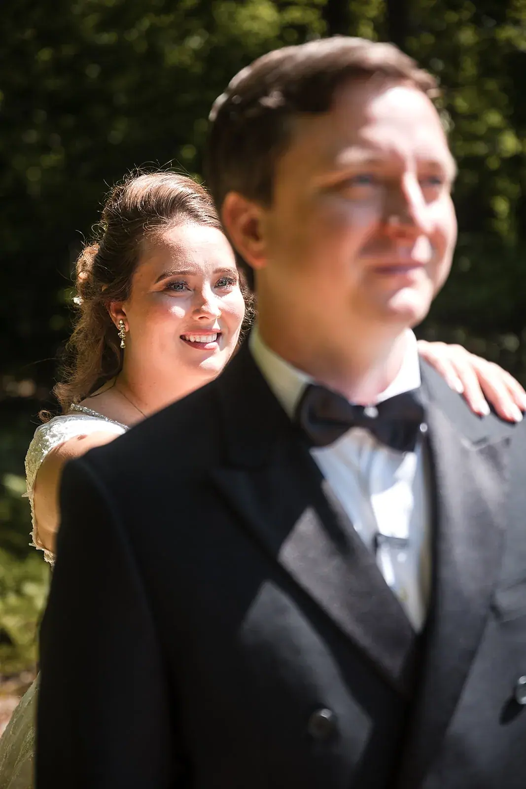 Bride hugging groom from behind — Amelia & Howard's wedding at Sunset Hill Wedding Barn, Central Lake