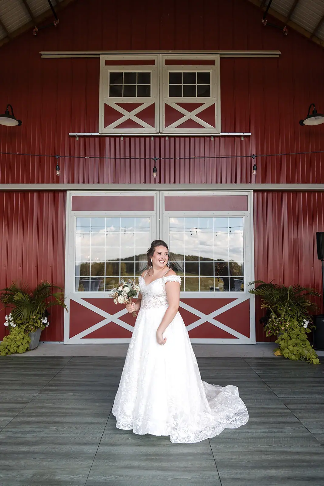 Bride portrait red barn doors — Amelia & Howard's wedding at Sunset Hill Wedding Barn, Central Lake