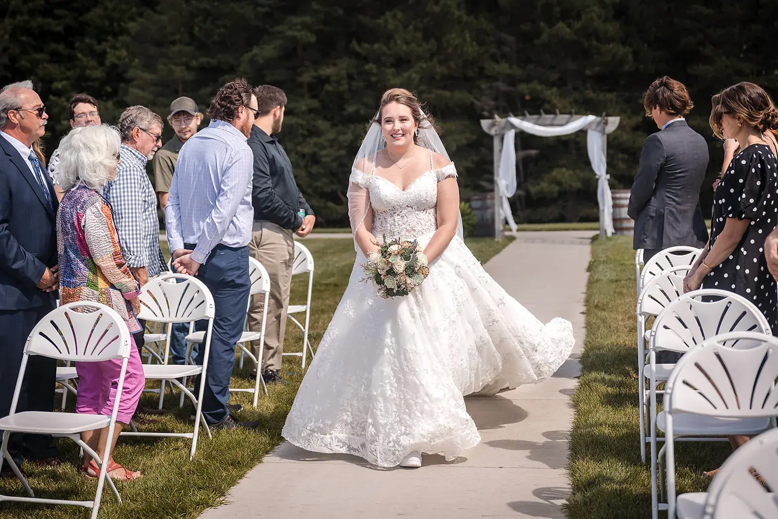 Bride walking aisle guests — Amelia & Howard's wedding at Sunset Hill Wedding Barn, Central Lake
