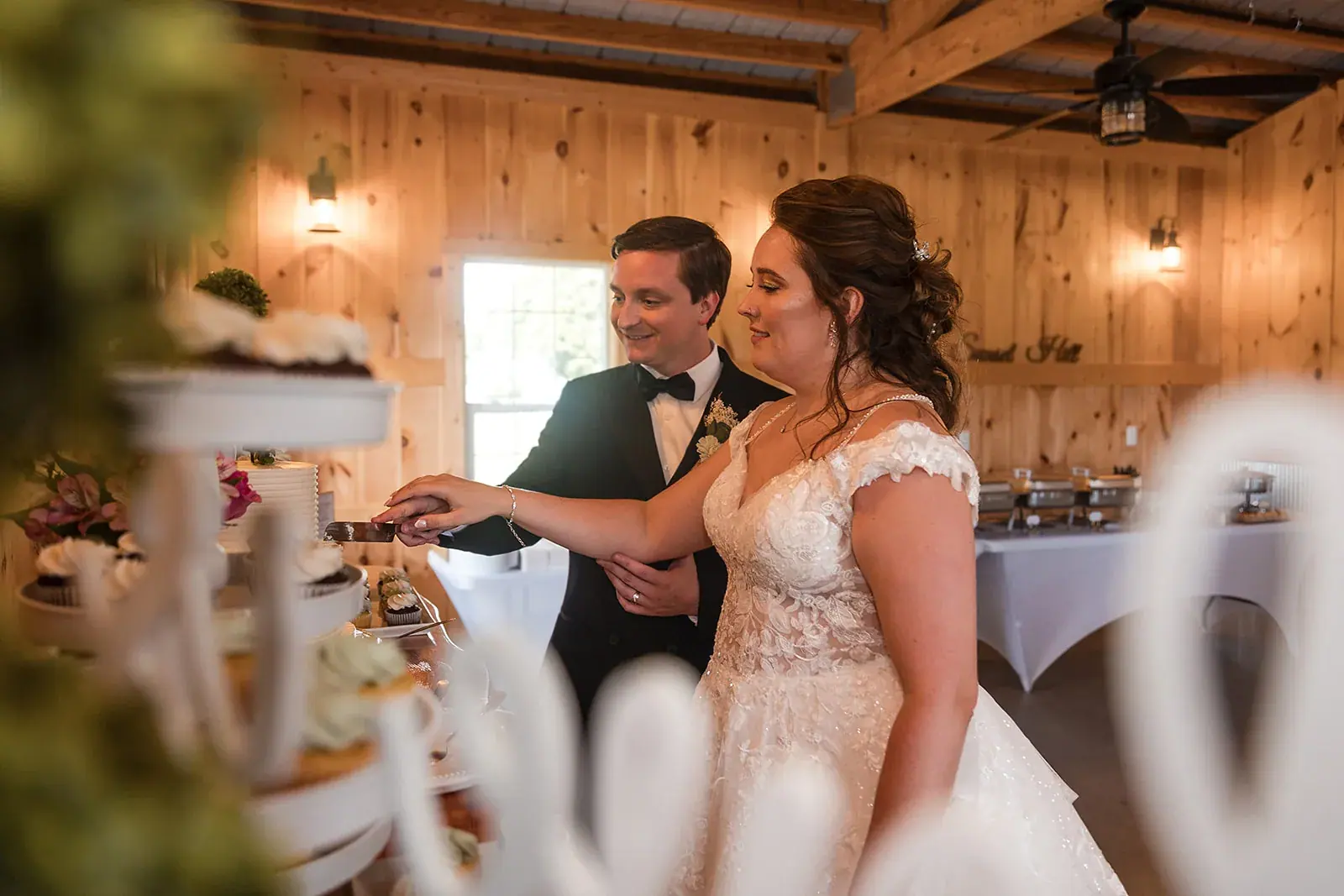 Cake cutting barn — Amelia & Howard's wedding at Sunset Hill Wedding Barn, Central Lake