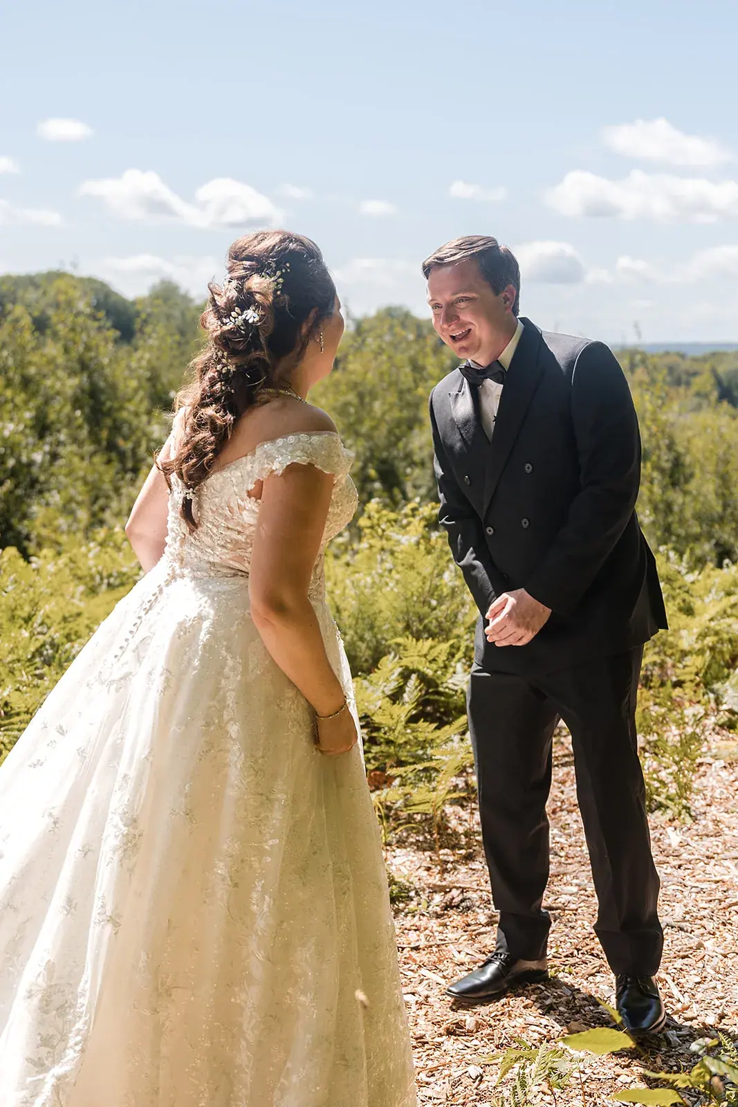 First look bride and groom field — Amelia & Howard's wedding at Sunset Hill Wedding Barn, Central Lake