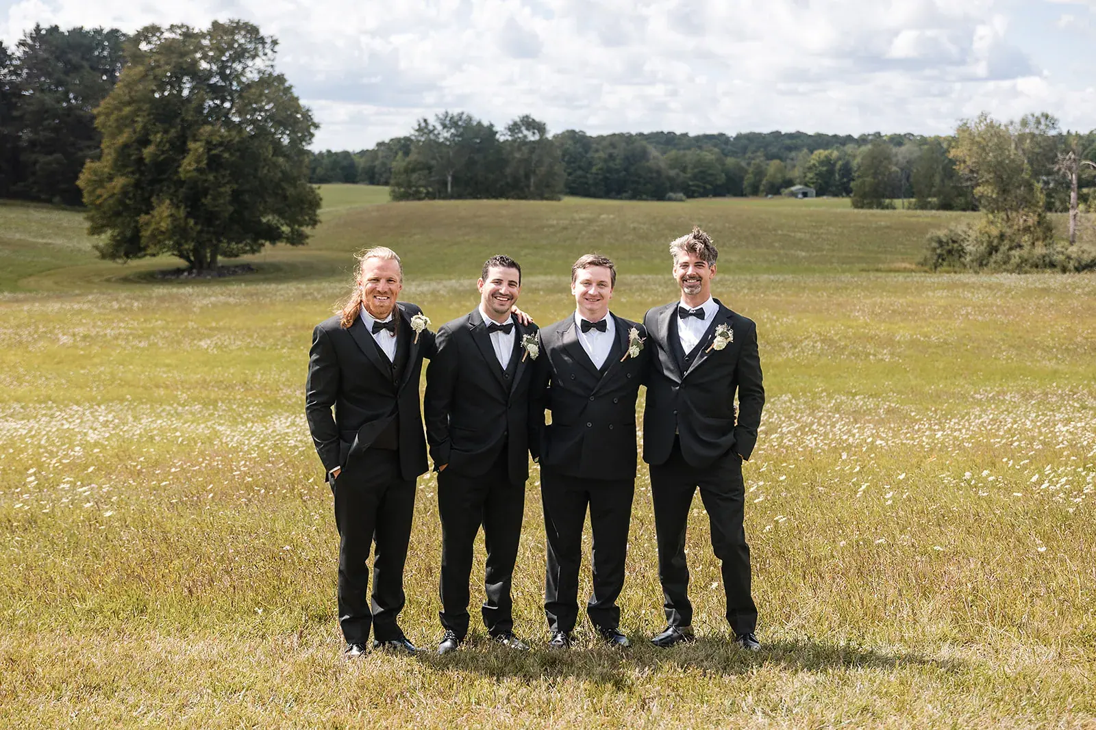 Groom groomsmen field — Amelia & Howard's wedding at Sunset Hill Wedding Barn, Central Lake