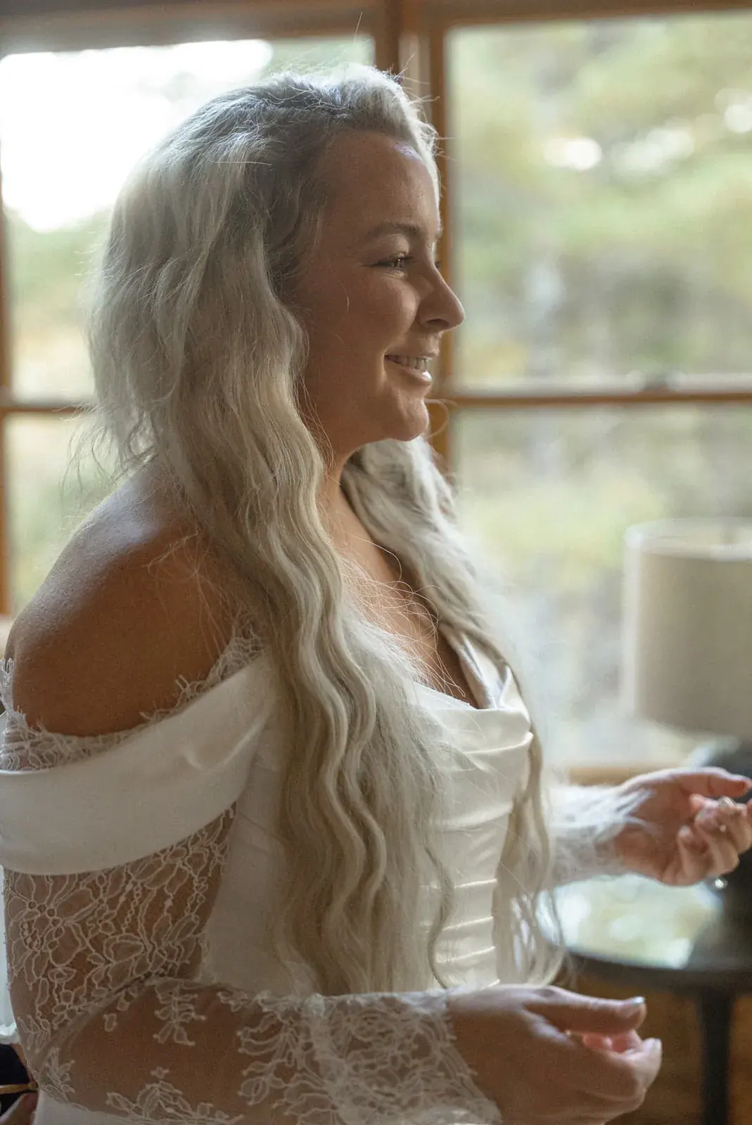 Bride getting ready window light — Ann & Brad's wedding at their log home in Vanderbilt