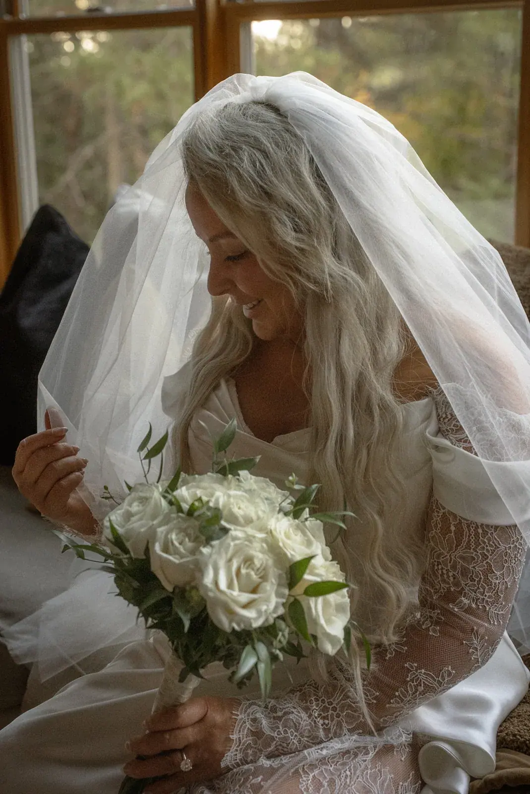 Bride veil bouquet close — Ann & Brad's wedding at their log home in Vanderbilt