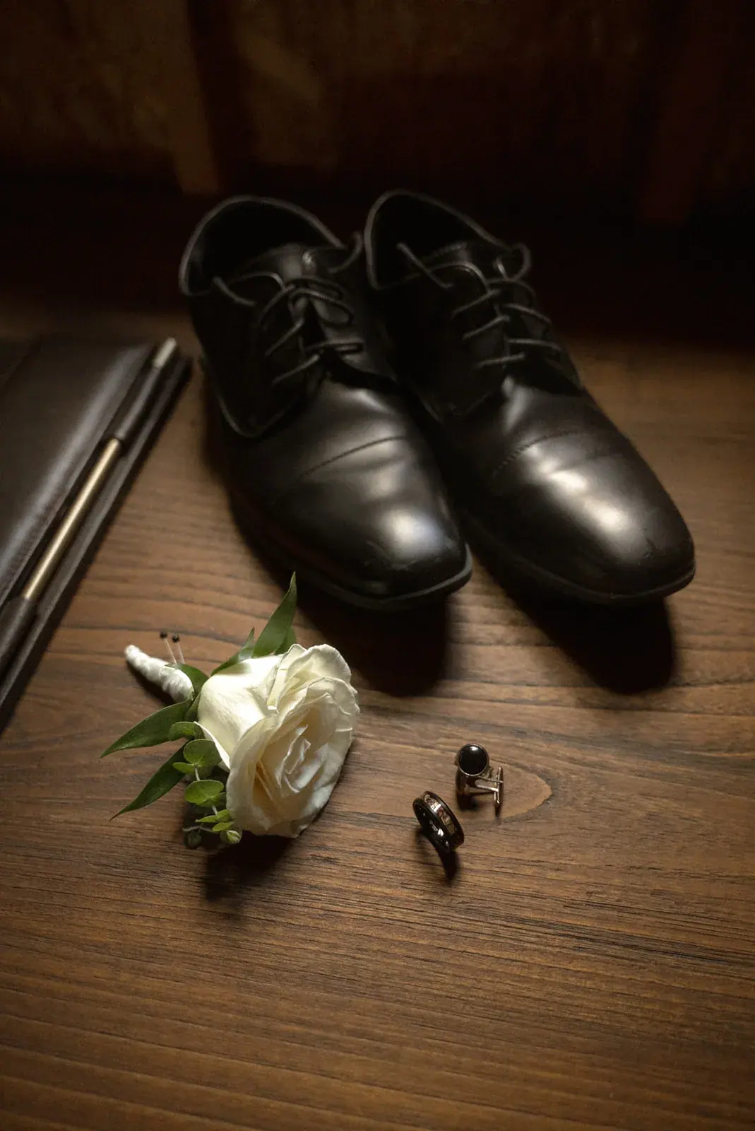 Groom shoes boutonniere rings detail — Ann & Brad's wedding at their log home in Vanderbilt