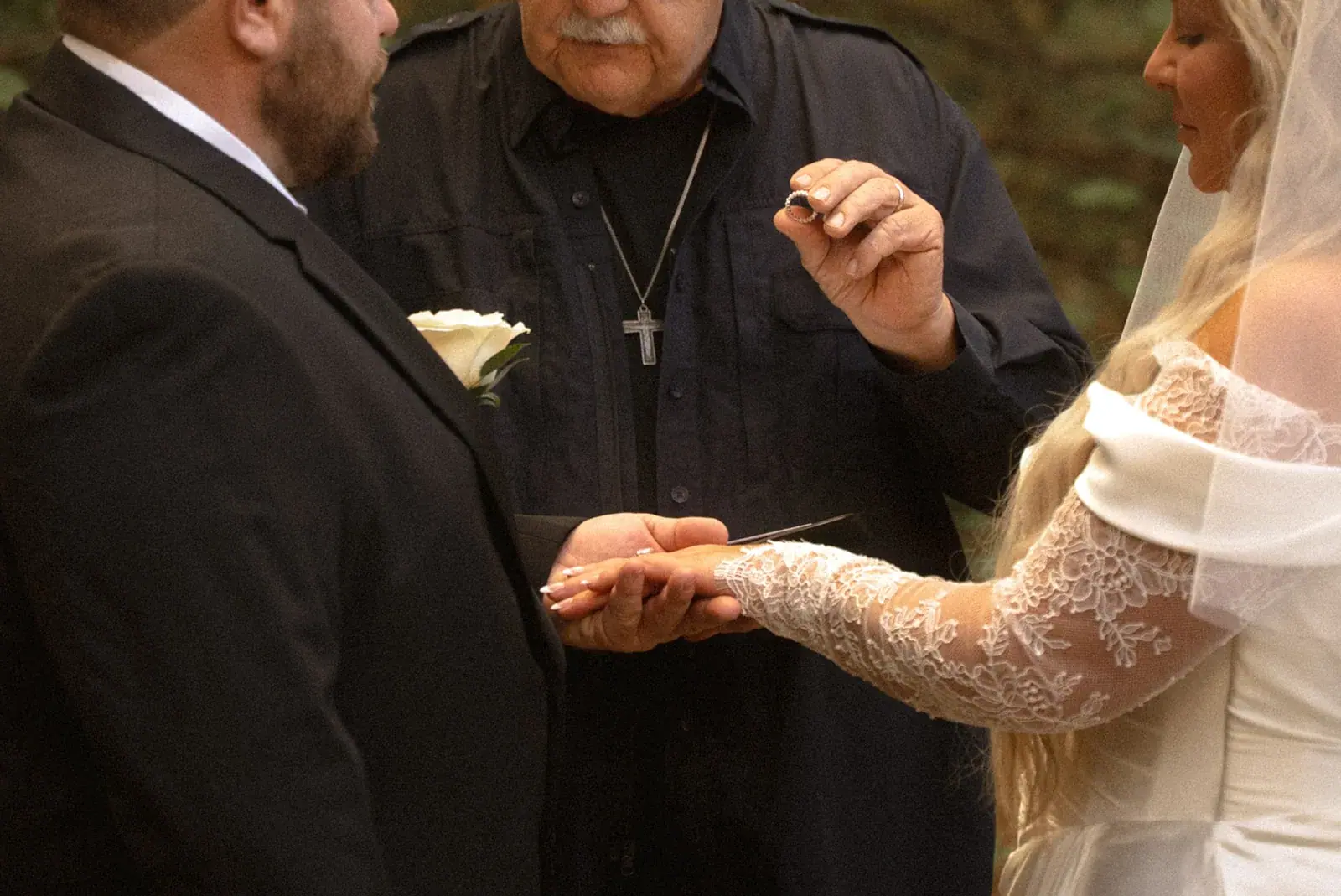 Ring exchange officiant — Ann & Brad's wedding at their log home in Vanderbilt