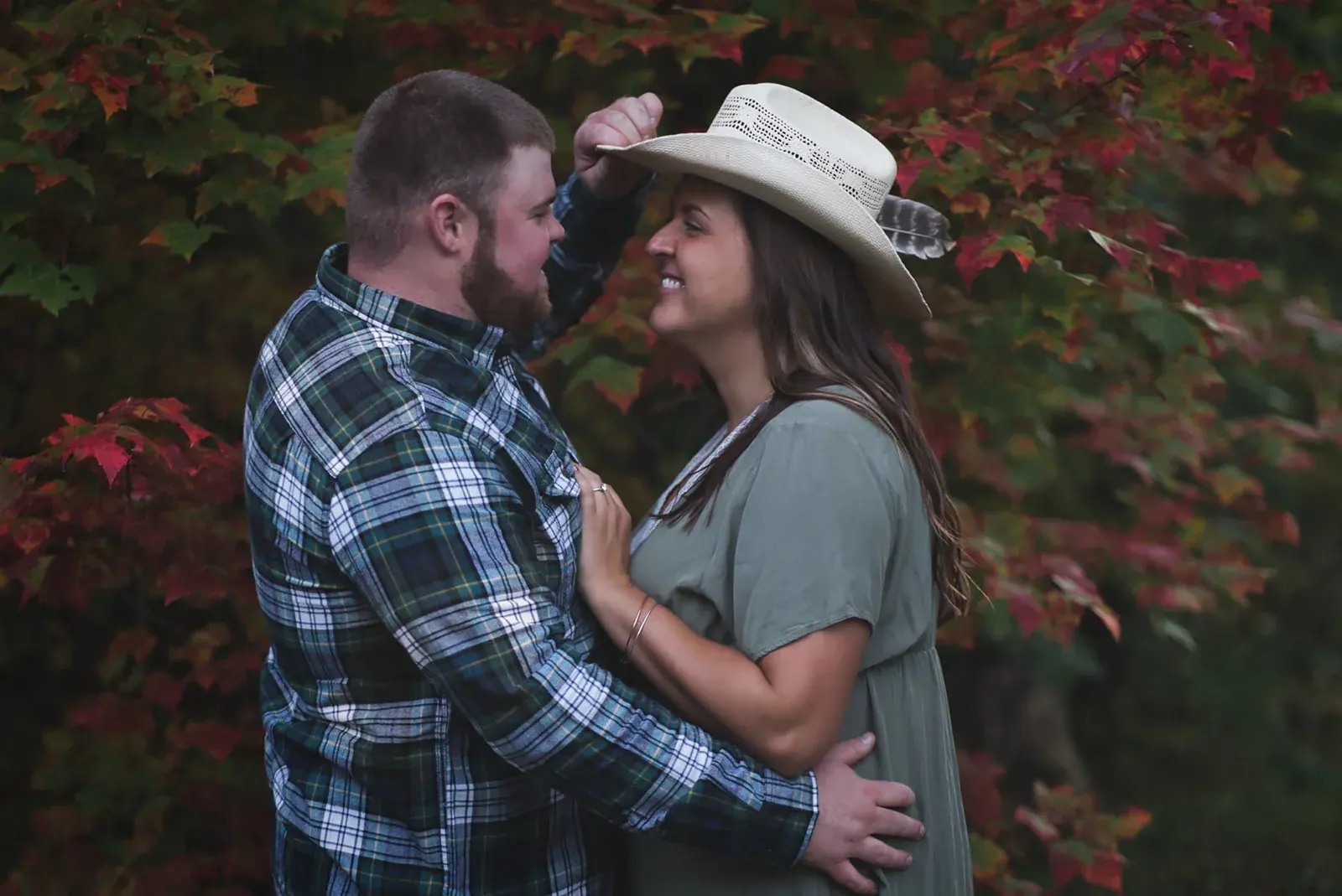 Couple cowboy hat red foliage — Chelsea & Jake's engagement session at Aspen Park, Gaylord