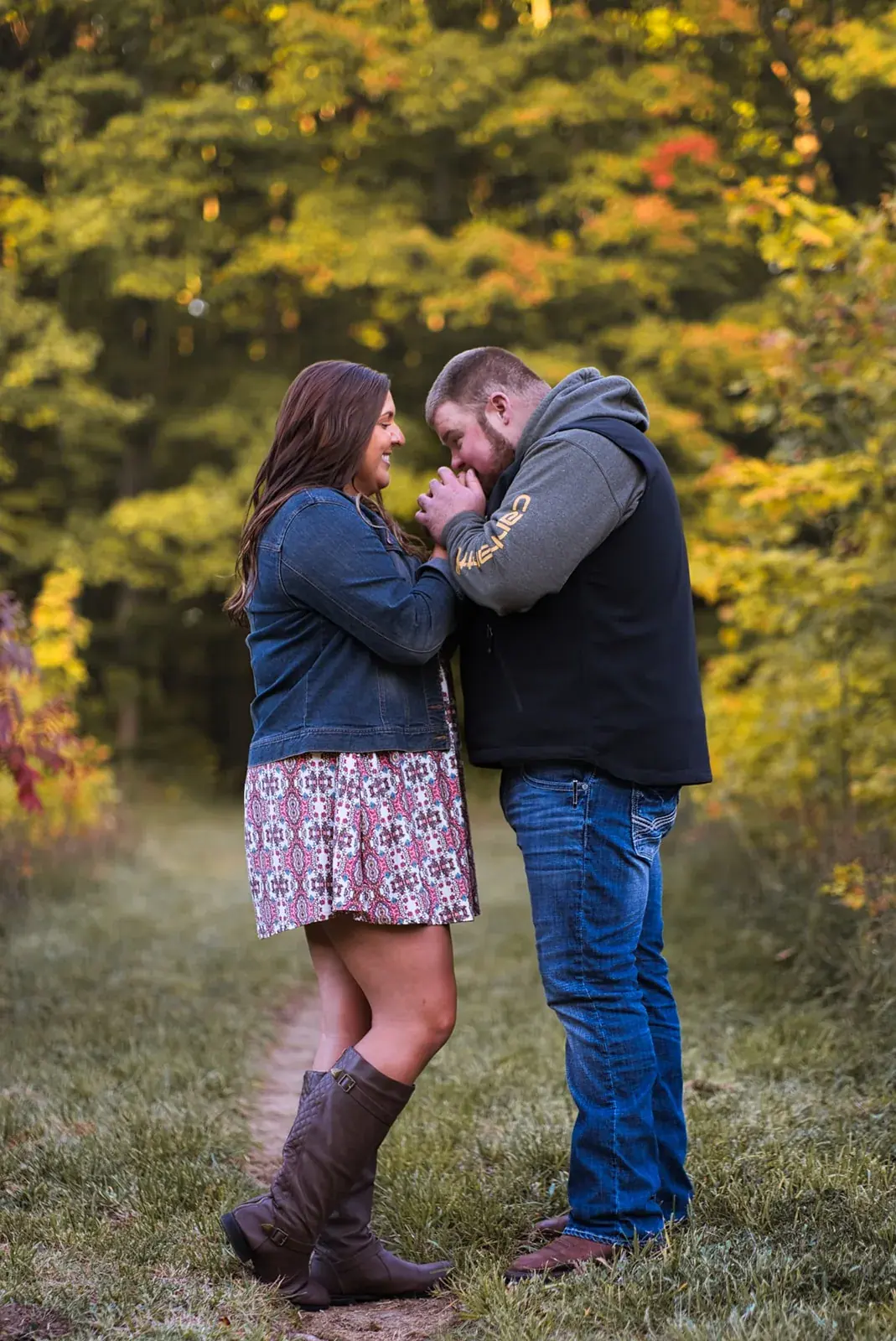 Couple embrace fall colors — Chelsea & Jake's engagement session at Aspen Park, Gaylord