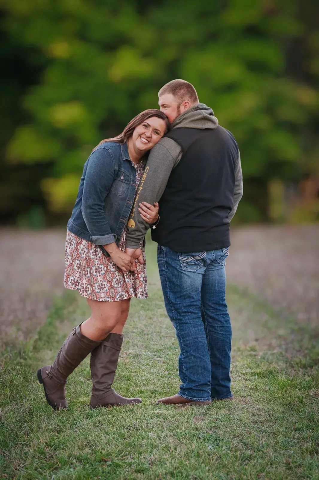 Couple embrace meadow trail — Chelsea & Jake's engagement session at Aspen Park, Gaylord