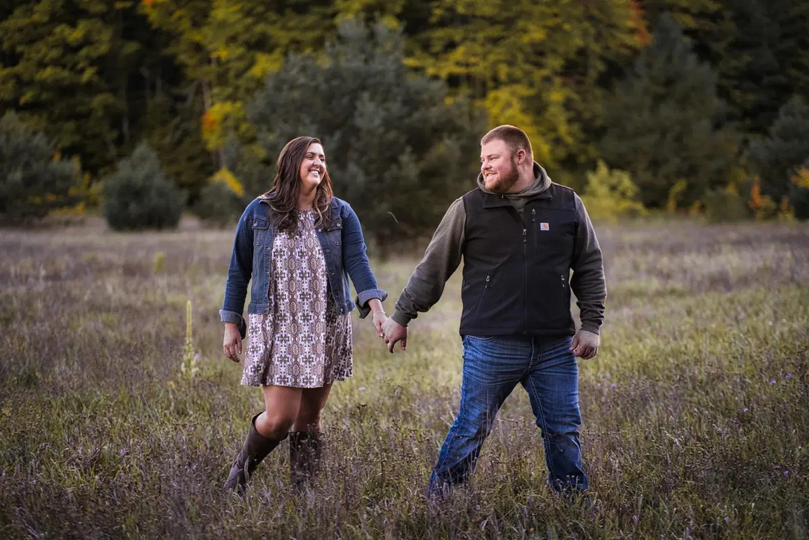 Couple holding hands meadow — Chelsea & Jake's engagement session at Aspen Park, Gaylord