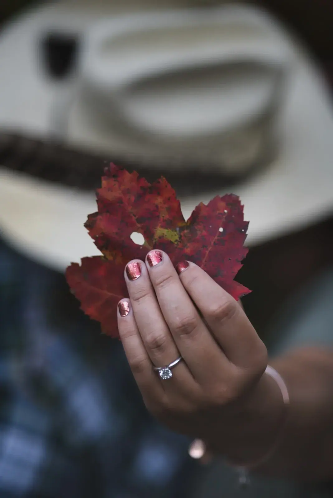 Engagement ring and red maple leaf — Chelsea & Jake's engagement session at Aspen Park, Gaylord