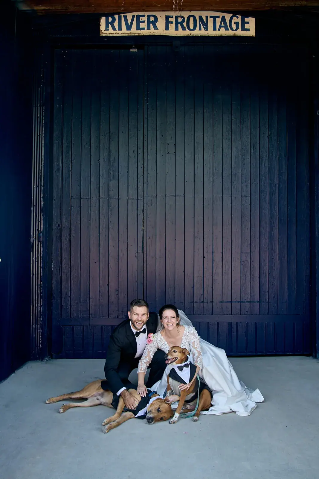 Bride and groom dogs river frontage door — Claire & Nick's wedding at Howe Marine, Indian River