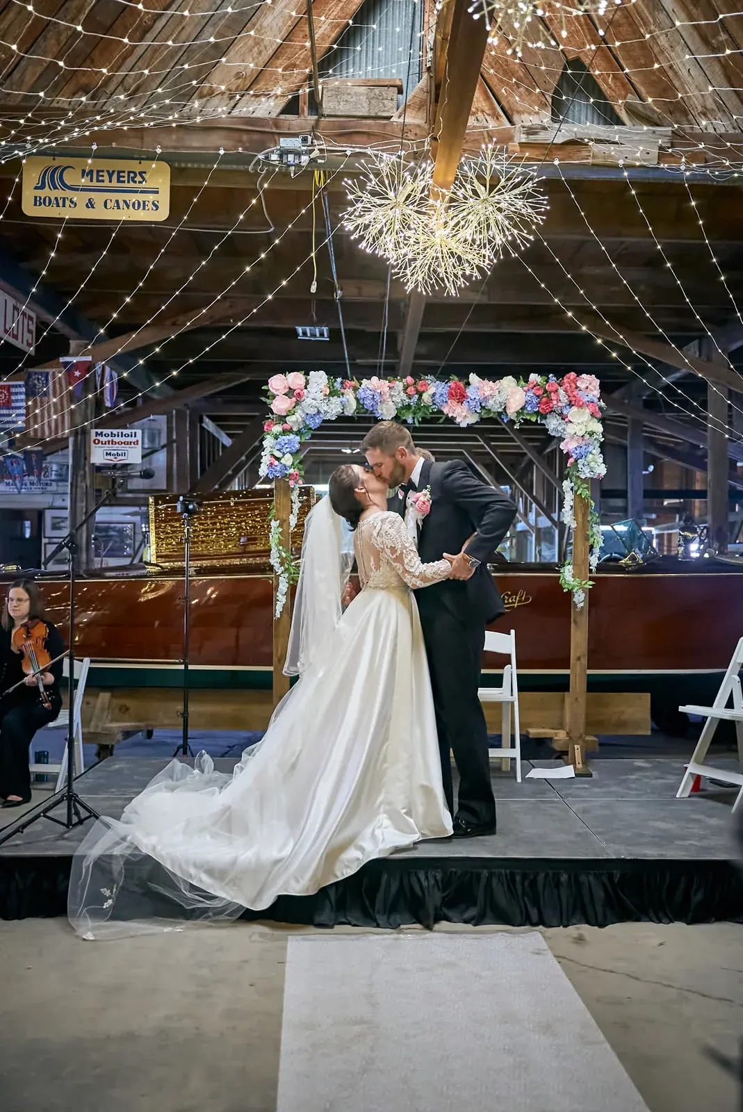 Ceremony floral arch boathouse — Claire & Nick's wedding at Howe Marine, Indian River