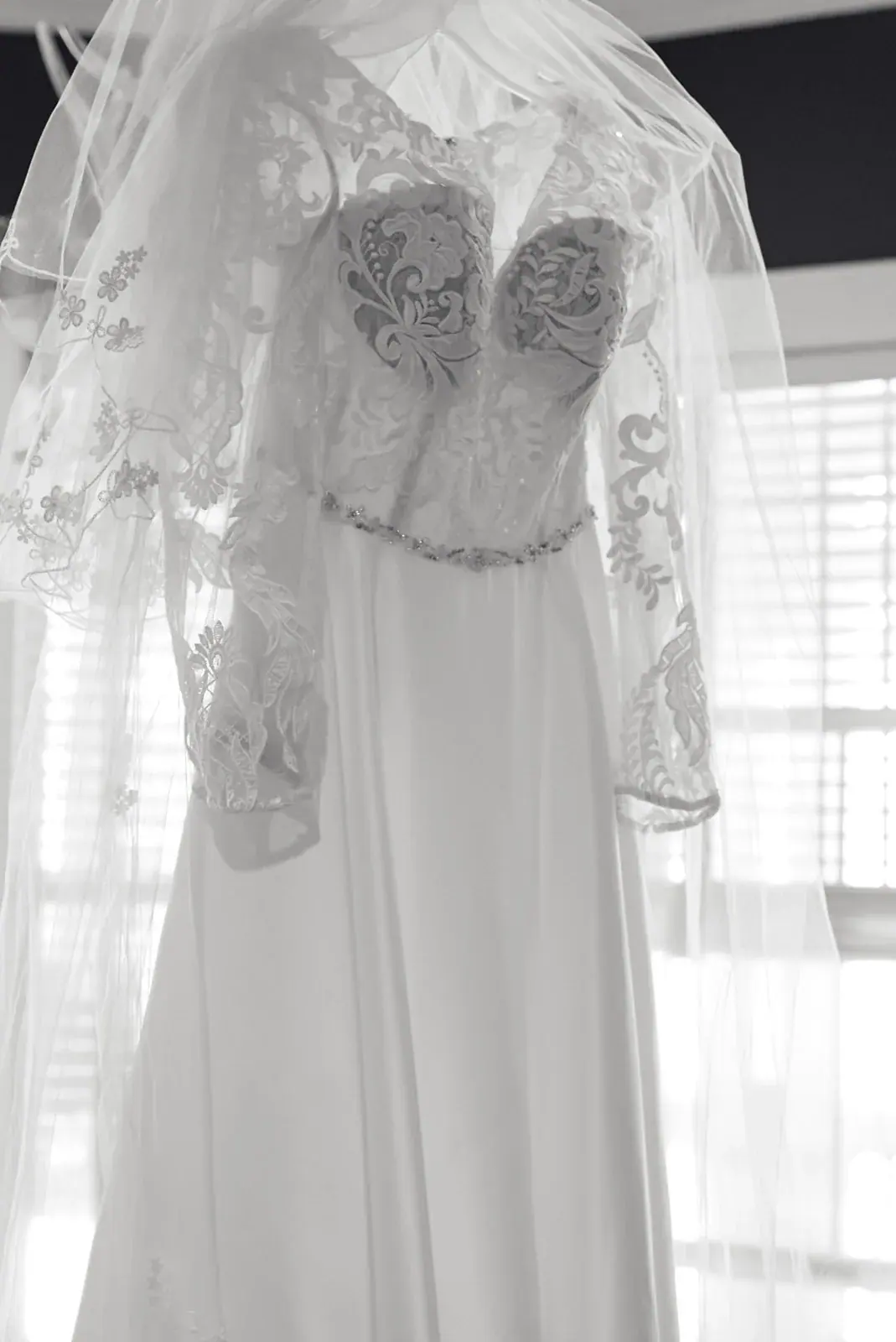 Wedding dress hanging window — Claire & Nick's wedding at Howe Marine, Indian River