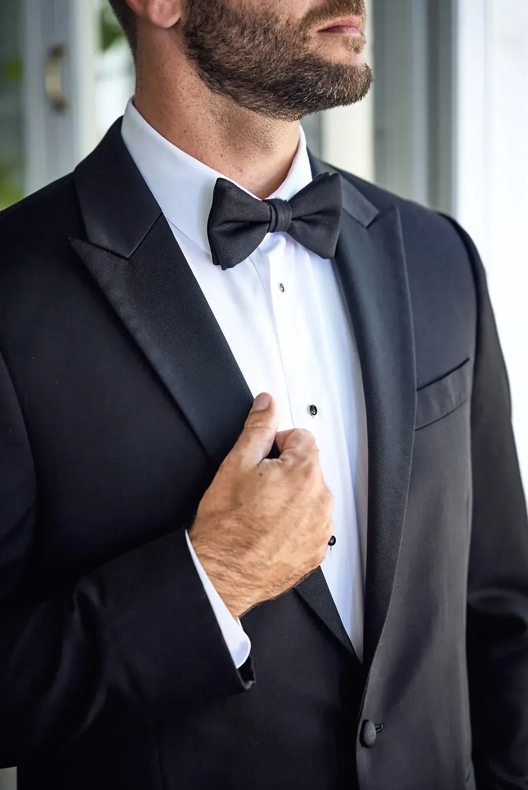 Groom adjusting tuxedo — Claire & Nick's wedding at Howe Marine, Indian River