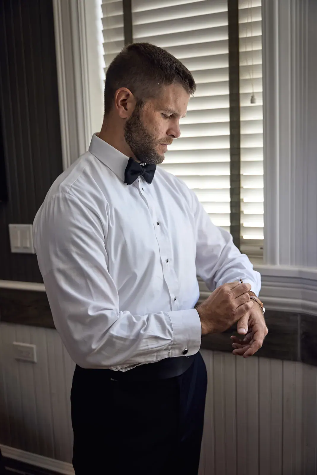 Groom cufflinks window — Claire & Nick's wedding at Howe Marine, Indian River