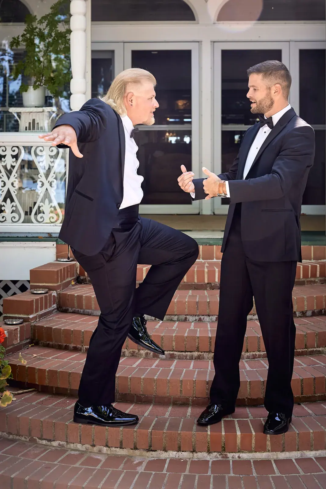 Groom groomsman dancing porch steps — Claire & Nick's wedding at Howe Marine, Indian River