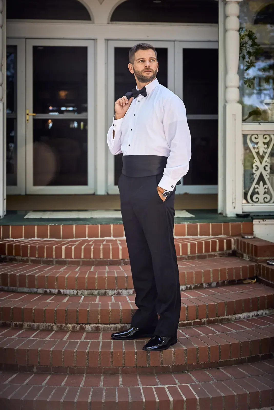 Groom porch steps — Claire & Nick's wedding at Howe Marine, Indian River