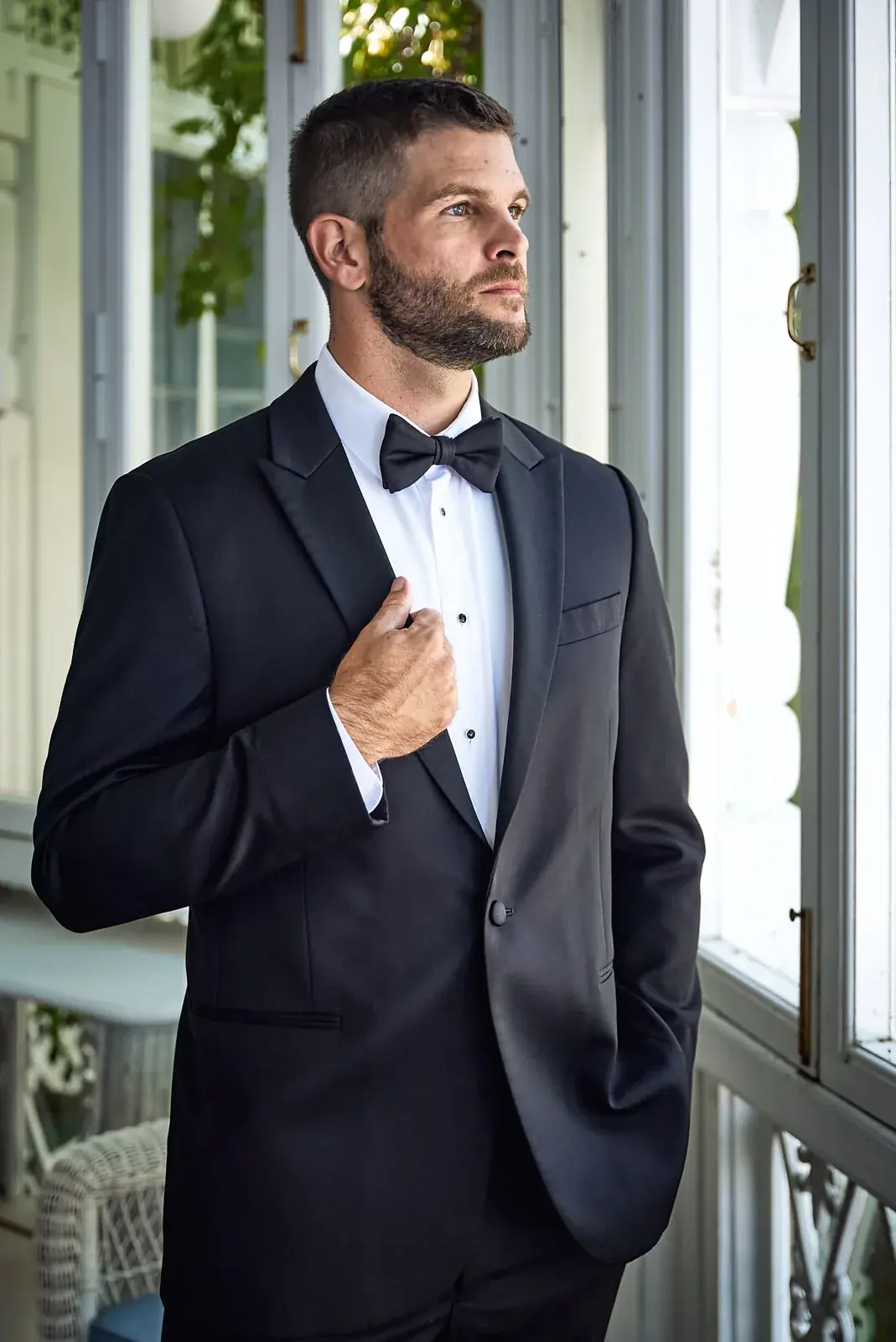 Groom portrait porch — Claire & Nick's wedding at Howe Marine, Indian River