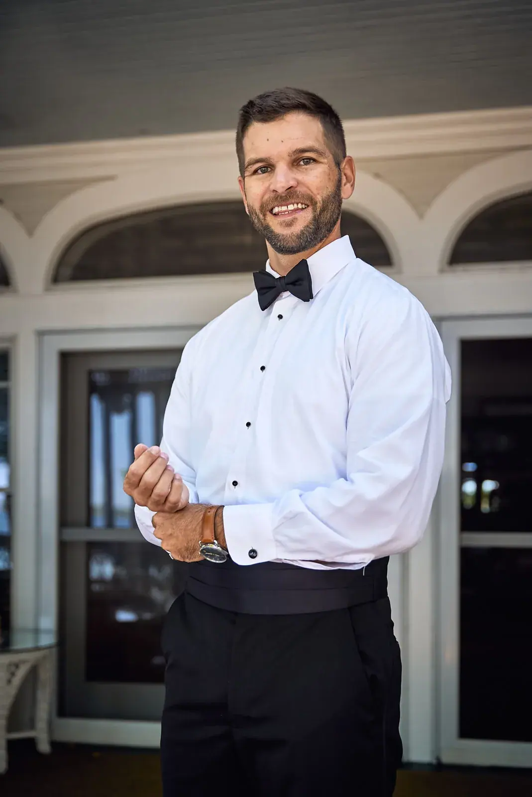 Groom tuxedo portrait smiling — Claire & Nick's wedding at Howe Marine, Indian River