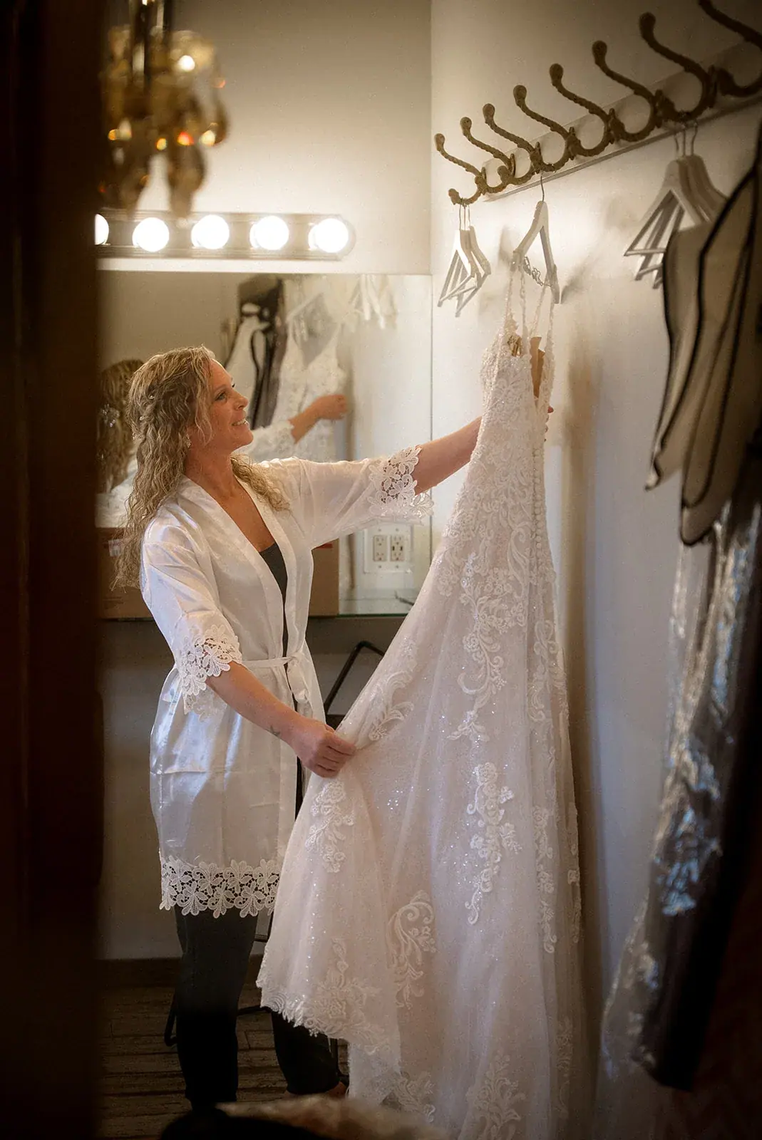 Bride getting ready dress hanging — Erin & Jim's wedding at Sonshine Barn, Gaylord
