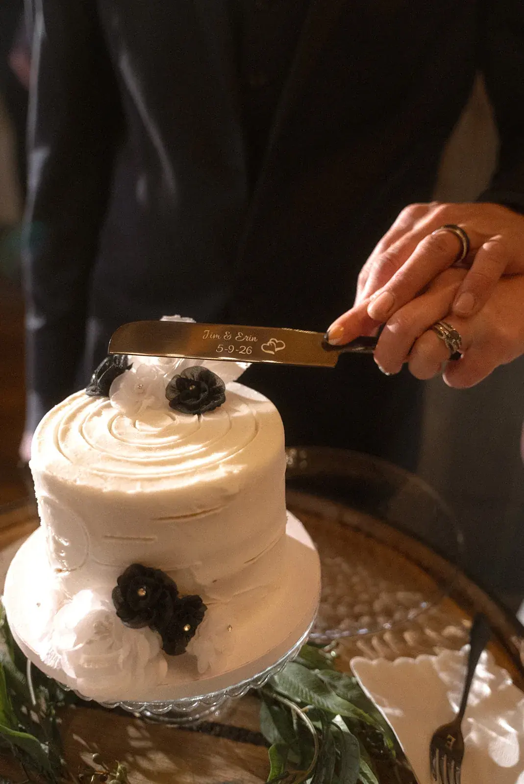 Cake cutting detail — Erin & Jim's wedding at Sonshine Barn, Gaylord