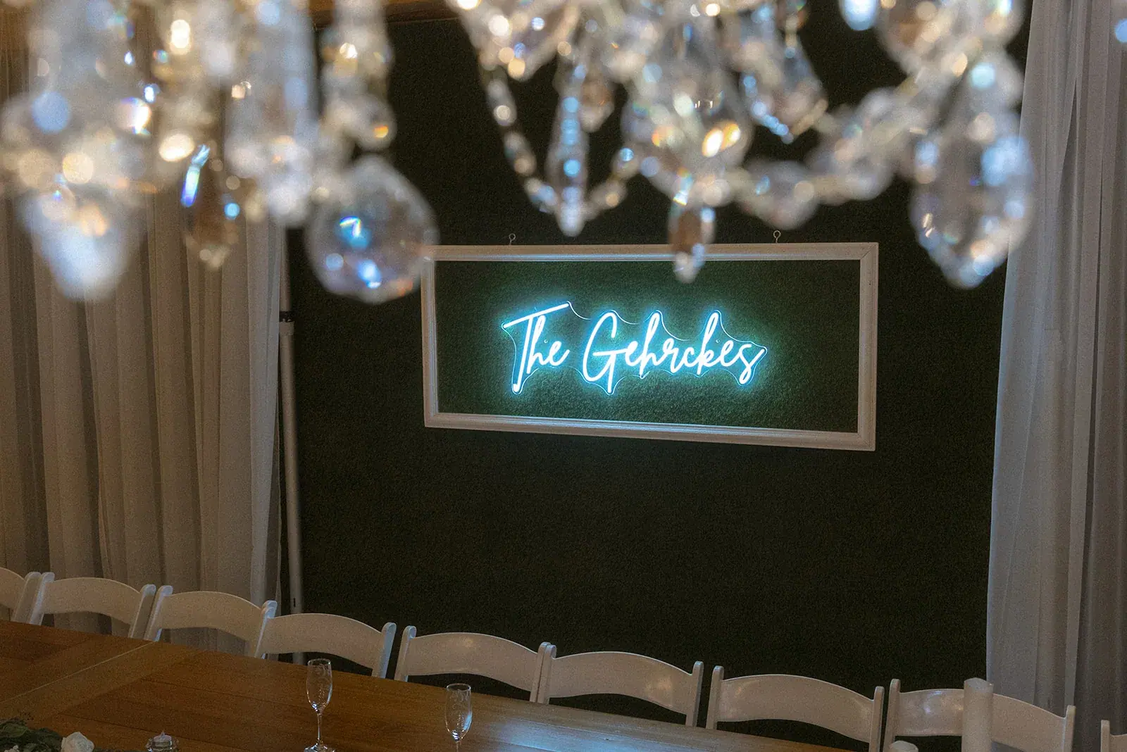 Neon sign chandelier reception — Erin & Jim's wedding at Sonshine Barn, Gaylord