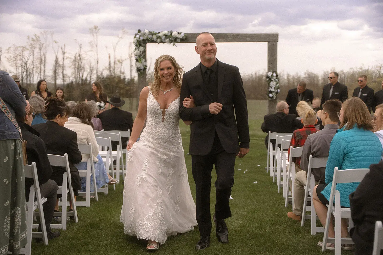 Recessional bride and groom — Erin & Jim's wedding at Sonshine Barn, Gaylord