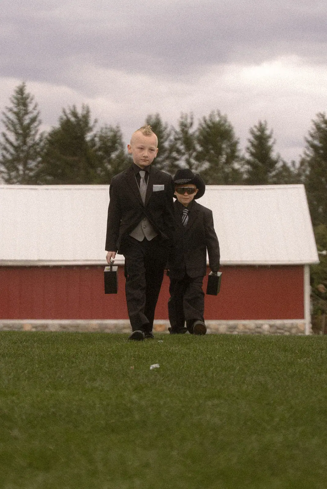 Ring bearers walking aisle — Erin & Jim's wedding at Sonshine Barn, Gaylord