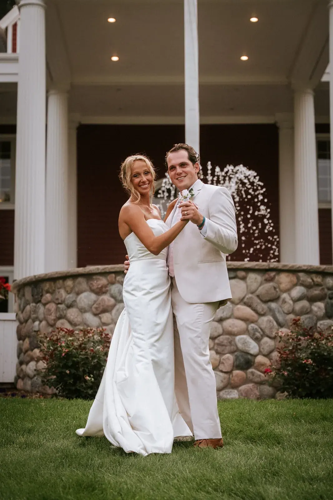 Bride and groom inn fountain — Heather & Evan's wedding at Black Star Farms