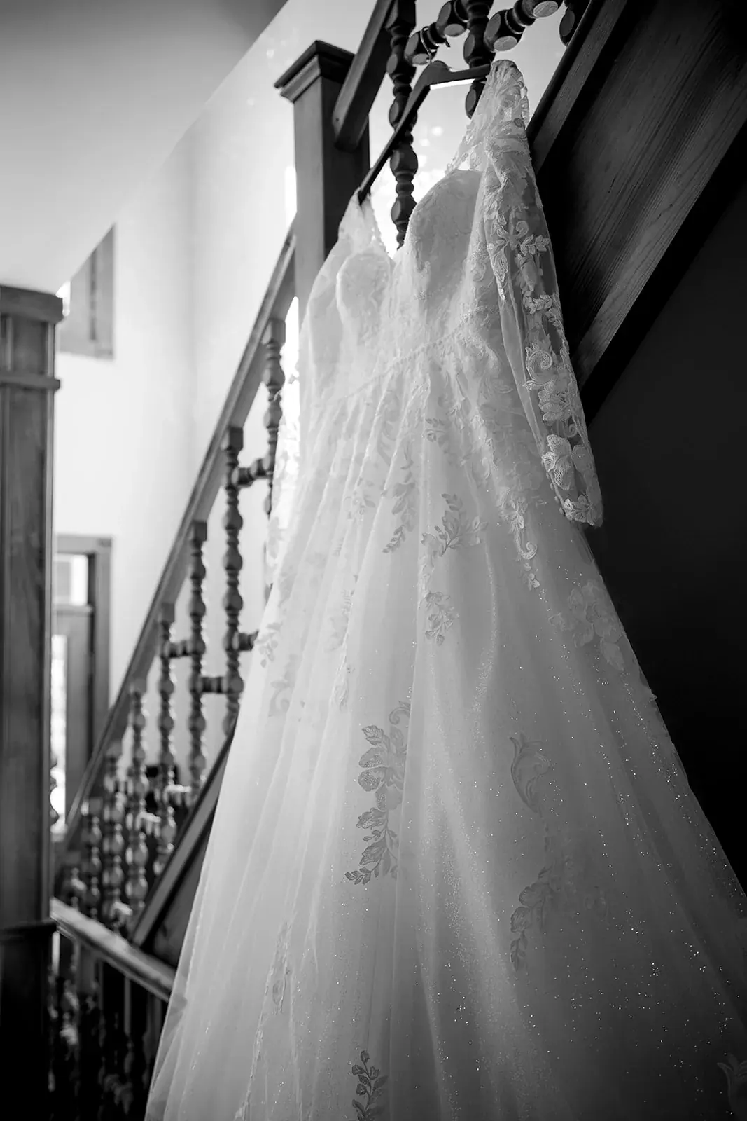 Wedding dress hanging staircase in black and white — Heather & Jason's wedding at The Manor at Fire Tower Hill, Lewiston