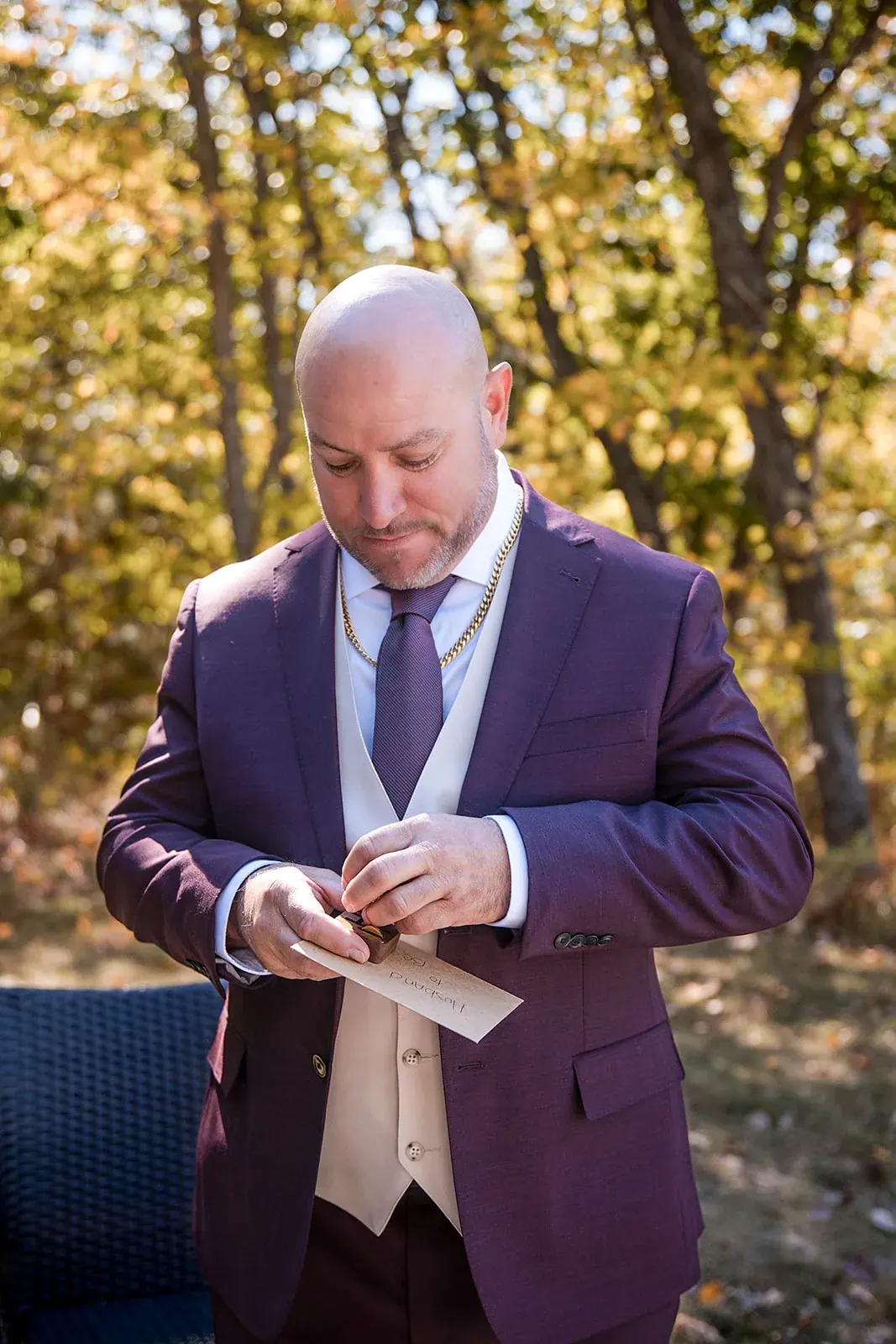 Groom reading letter fall woods — Heather & Jason's wedding at The Manor at Fire Tower Hill, Lewiston