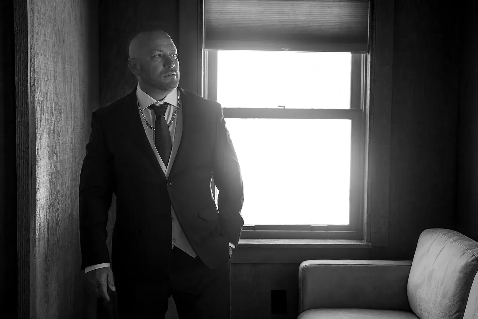 Groom window in black and white — Heather & Jason's wedding at The Manor at Fire Tower Hill, Lewiston