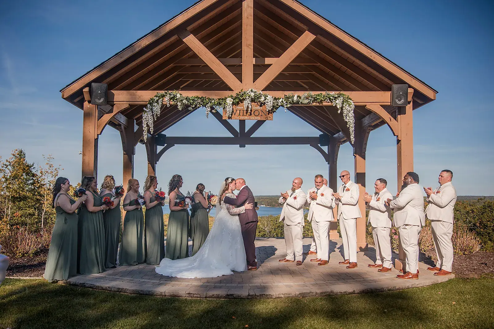 Pavilion ceremony kiss — Heather & Jason's wedding at The Manor at Fire Tower Hill, Lewiston