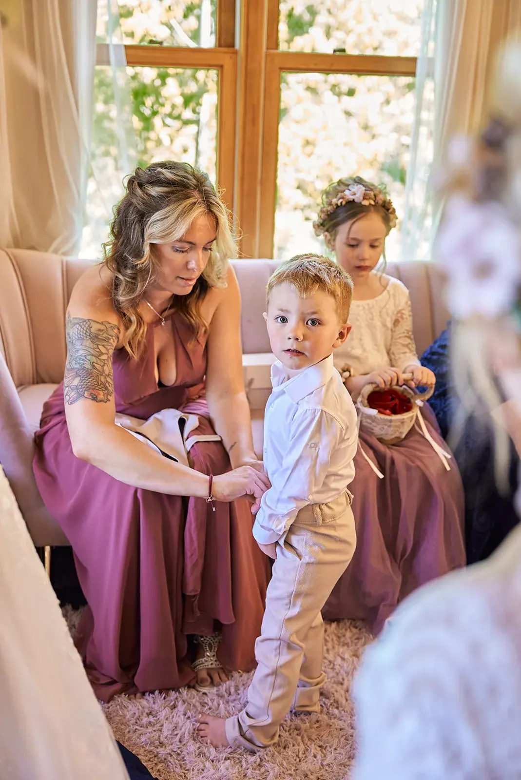Bride fixing ring bearer bow tie — Jess & Bryce's wedding at The Manor at Fire Tower Hill, Lewiston