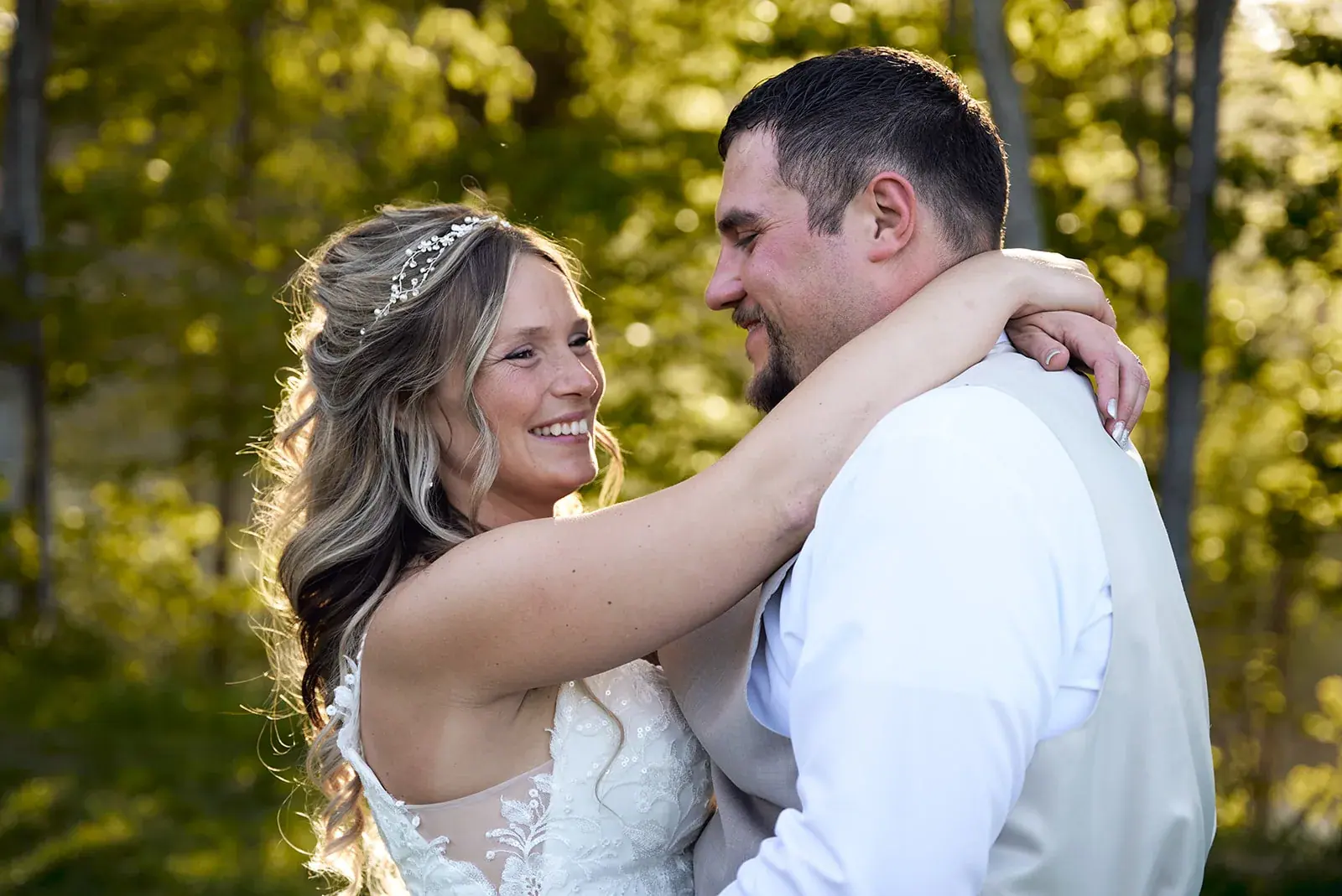 Bride and groom embrace close — Jess & Bryce's wedding at The Manor at Fire Tower Hill, Lewiston