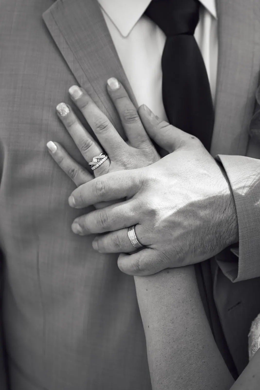 Bride and groom hands rings in black and white — Jess & Bryce's wedding at The Manor at Fire Tower Hill, Lewiston