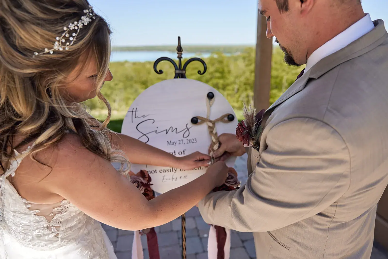 Bride pinning boutonniere — Jess & Bryce's wedding at The Manor at Fire Tower Hill, Lewiston