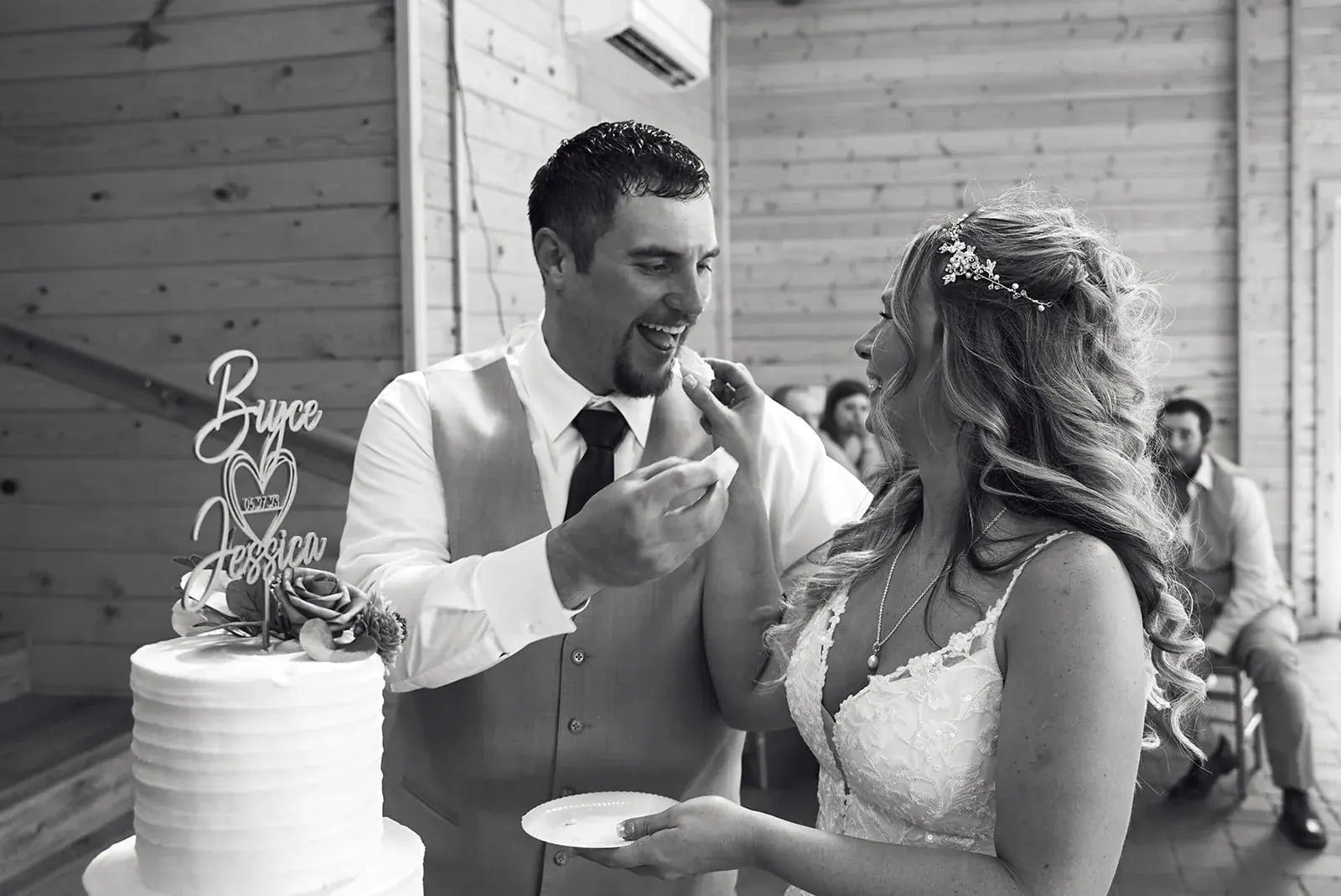 Cake cutting in black and white — Jess & Bryce's wedding at The Manor at Fire Tower Hill, Lewiston