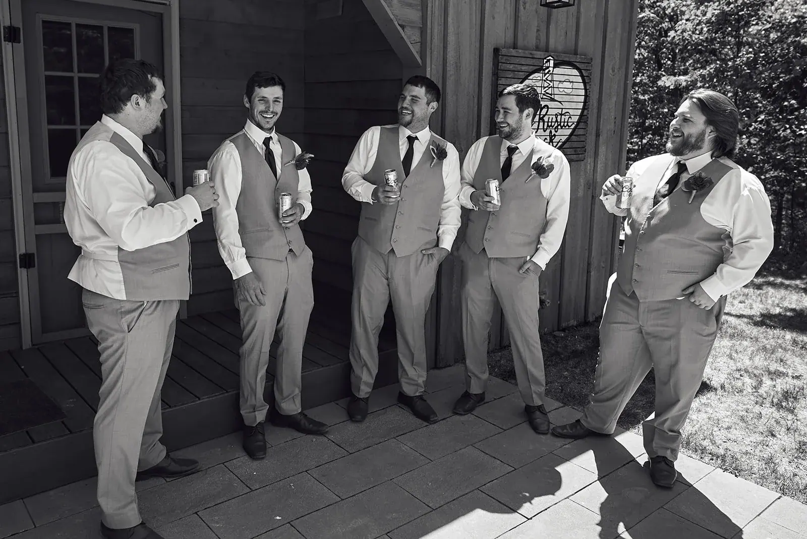 Groomsmen candid in black and white — Jess & Bryce's wedding at The Manor at Fire Tower Hill, Lewiston