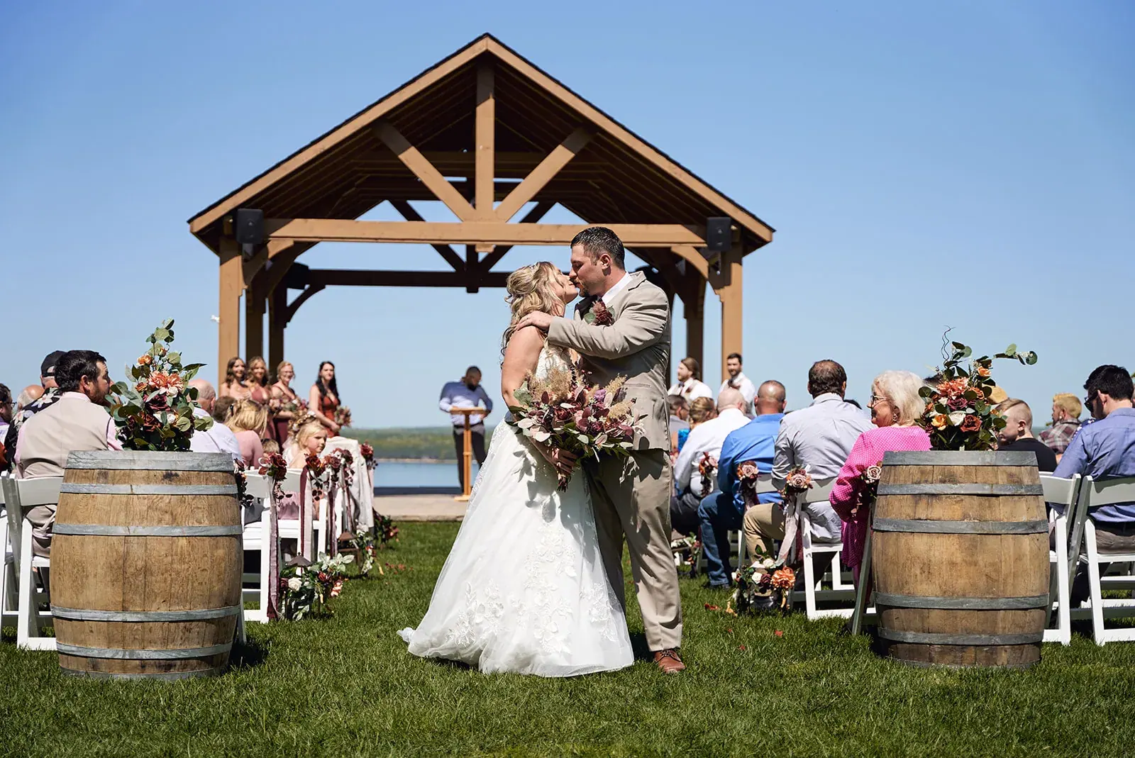 Pavilion ceremony kiss — Jess & Bryce's wedding at The Manor at Fire Tower Hill, Lewiston