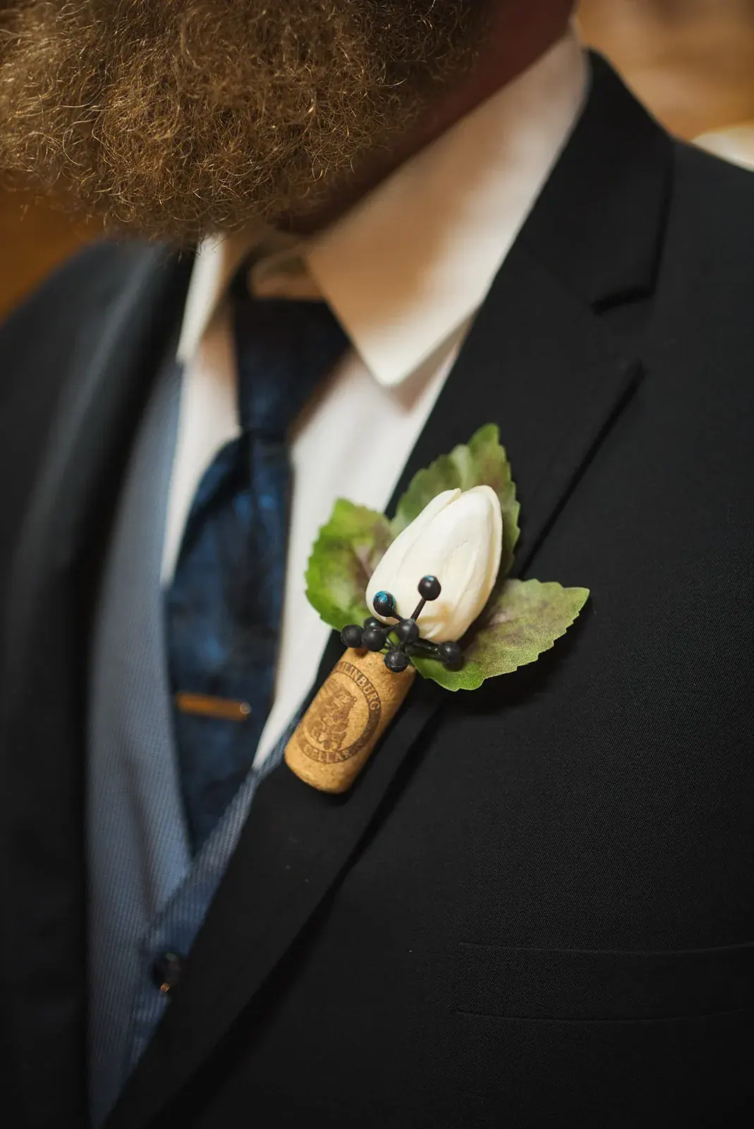 Boutonniere detail — Kayla & Robert's wedding at Mackinaw Trail Winery, Petoskey