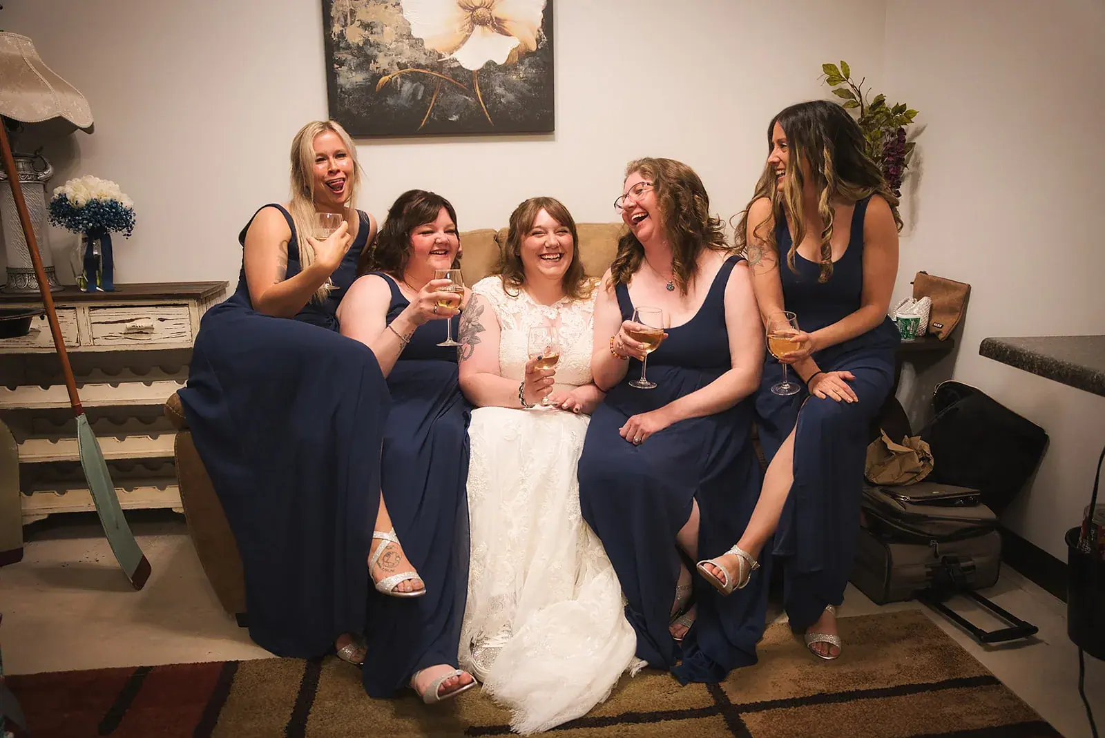 Bride bridesmaids sofa — Kayla & Robert's wedding at Mackinaw Trail Winery, Petoskey