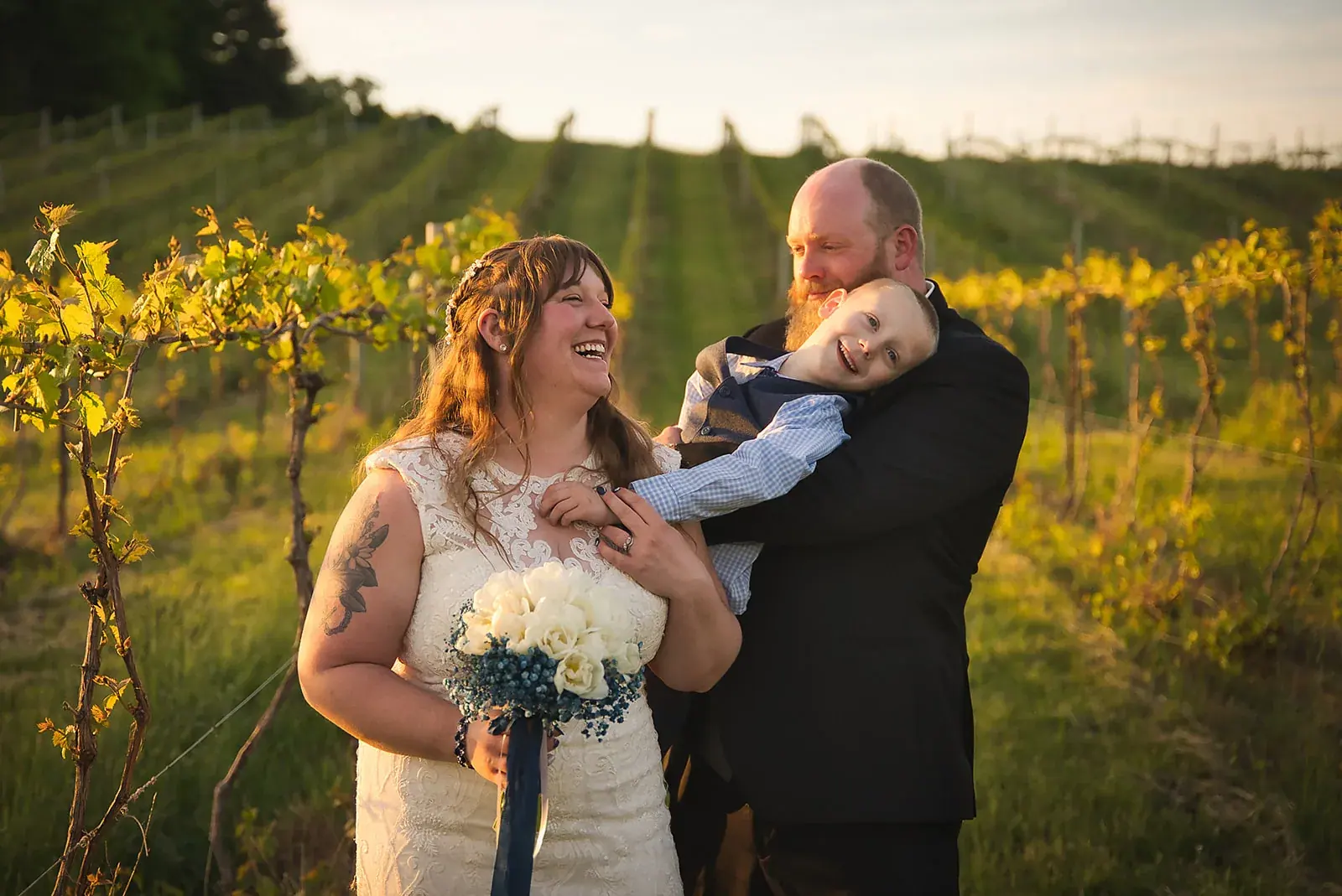 Bride and groom son vineyard golden — Kayla & Robert's wedding at Mackinaw Trail Winery, Petoskey