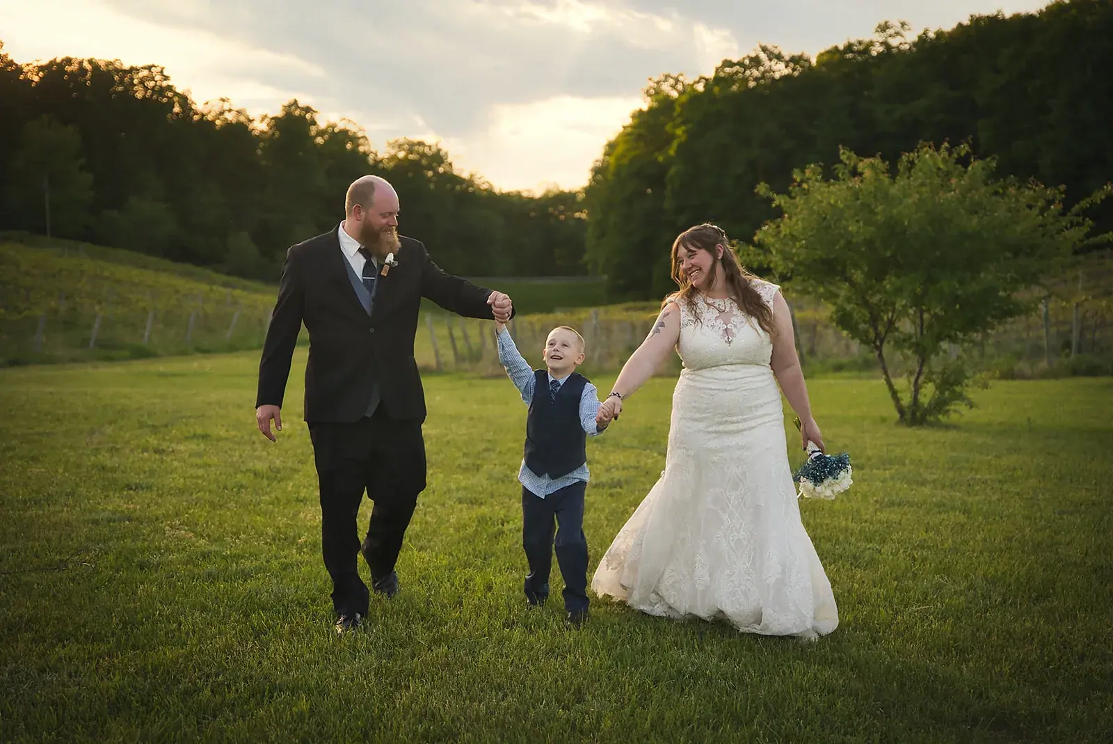 Bride and groom son walking vineyard — Kayla & Robert's wedding at Mackinaw Trail Winery, Petoskey
