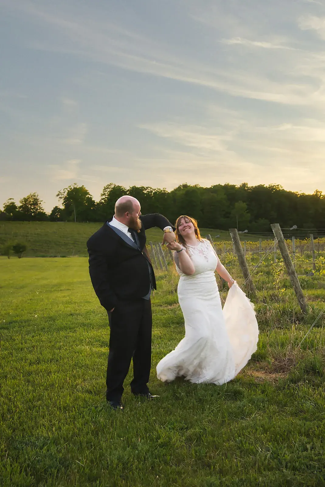 Bride and groom vineyard field — Kayla & Robert's wedding at Mackinaw Trail Winery, Petoskey