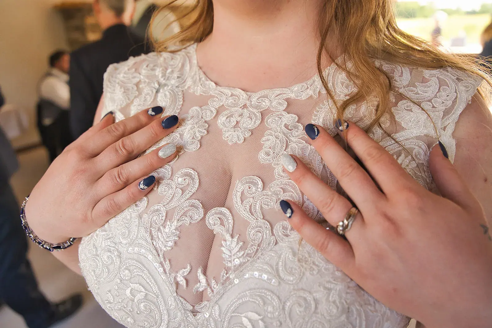 Bride lace dress hands detail — Kayla & Robert's wedding at Mackinaw Trail Winery, Petoskey